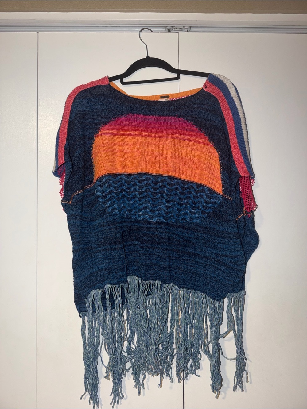 Free People Navy Blue Fringe Knit Poncho with Sunset Orange and Pink Accents